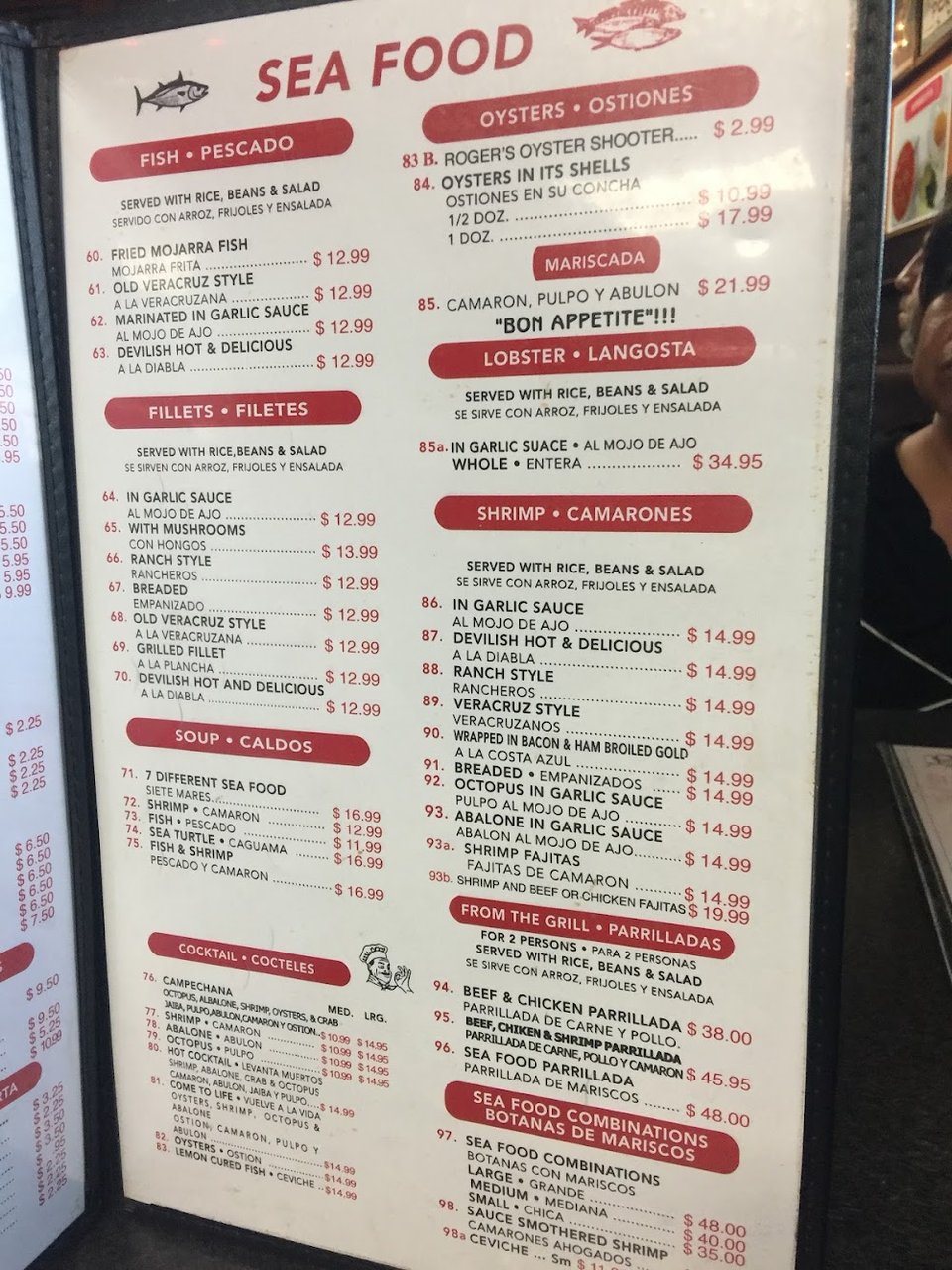Restaurant menu listing burritos, cocktails, and beverages.